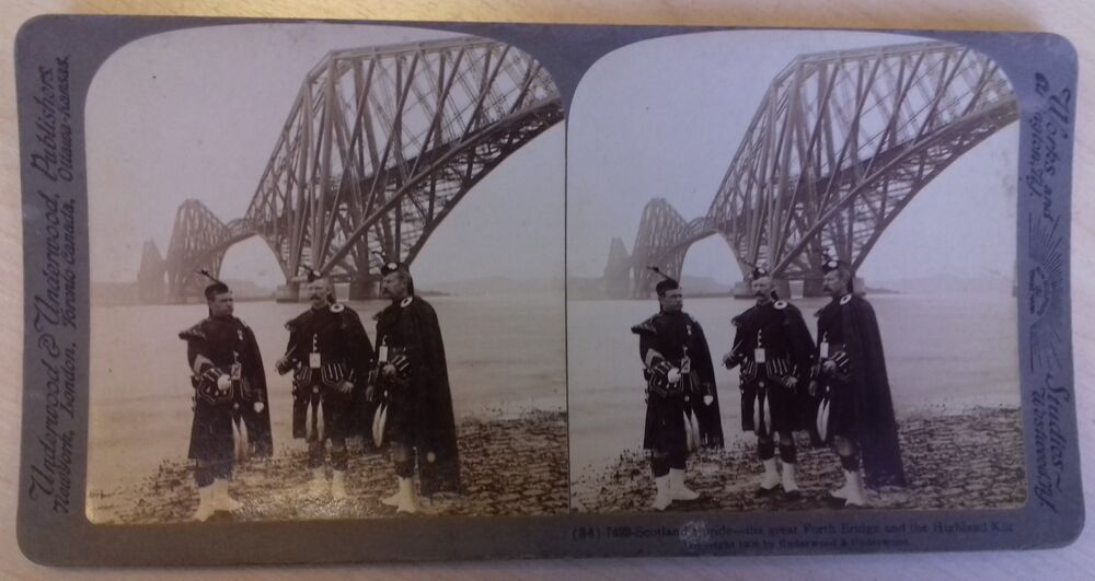 A card with two almost identical black and white photos of three men in kilts standing in front of the Forth Rail Bridge.