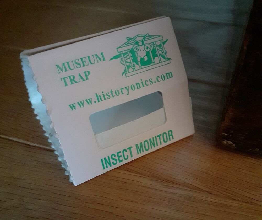 A small triangular museum trap used for monitoring insects