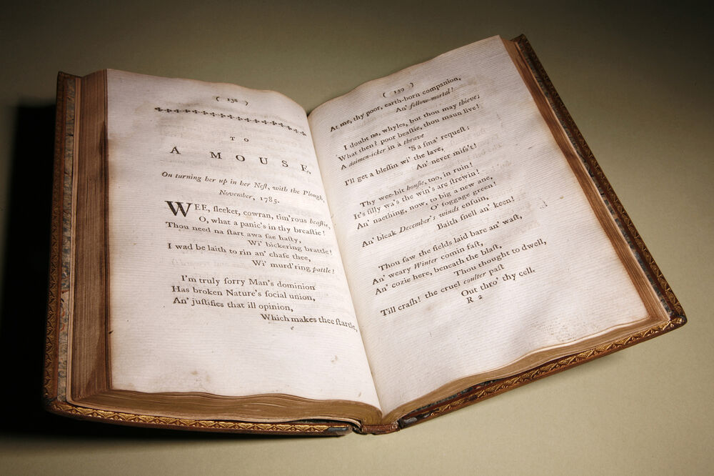 A 1786 copy of Robert Burns’s ‘Poems, Chiefly in the Scottish Dialect’ is displayed open at the page for ‘To a Mouse’.
