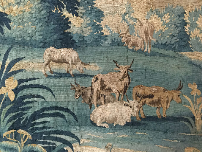 Detail in a tapestry of cattle, before cleaning