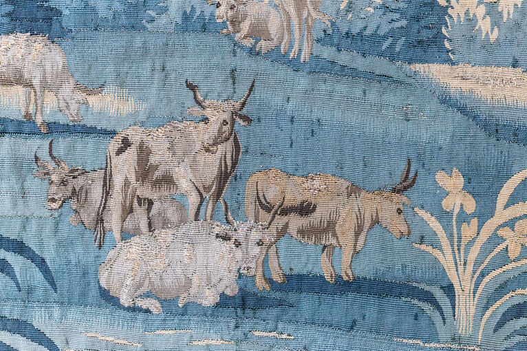 Detail in a tapestry of cattle after cleaning