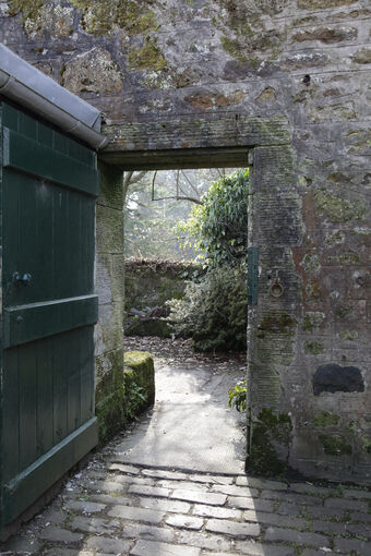 An open door in the wall at Greenbank Garden