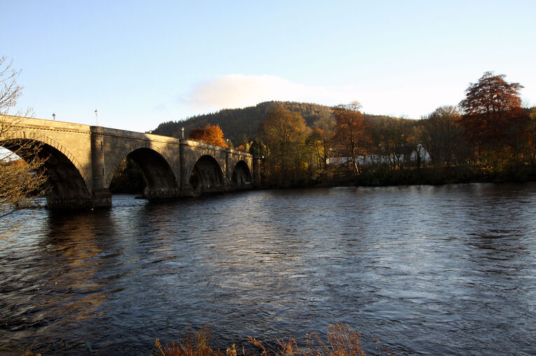 The River Tay running through Dunkeld on a sunny evening