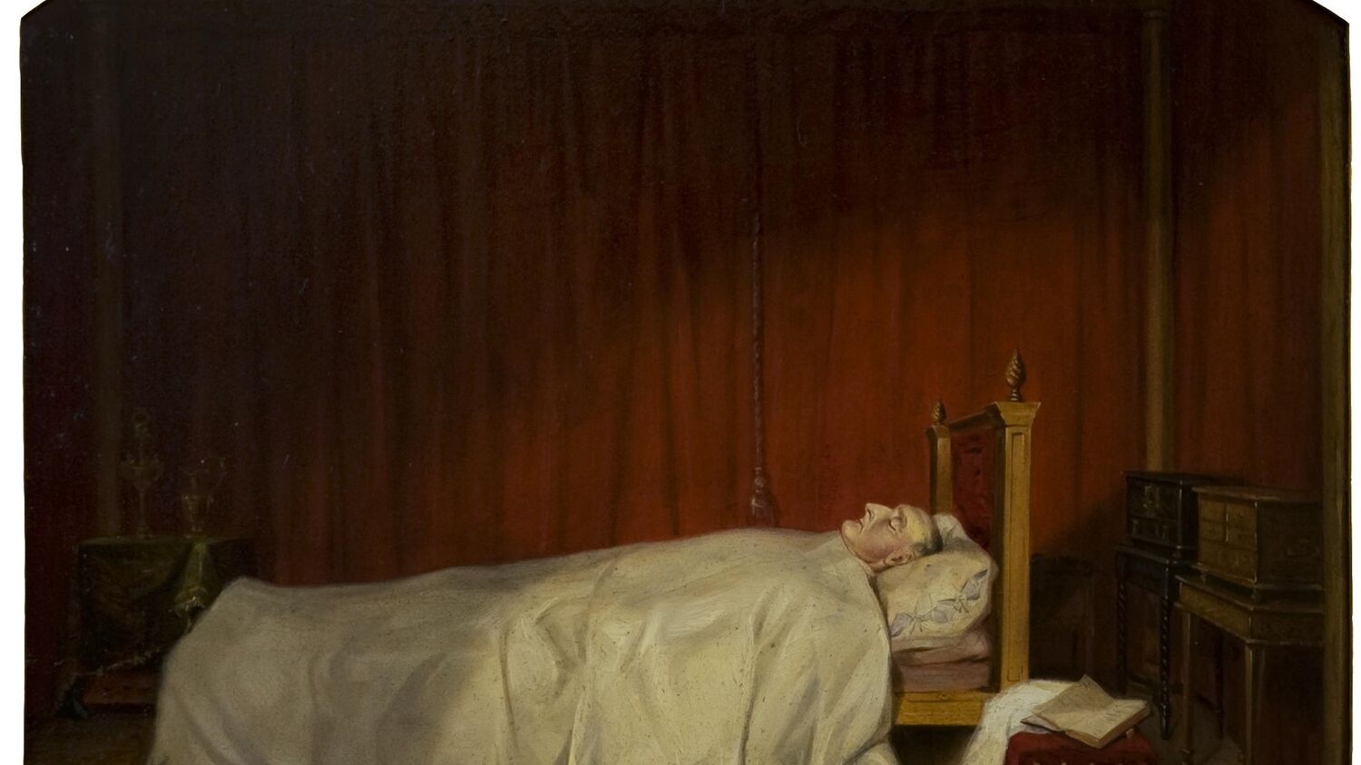 An oil painting, with a rounded top, of a very pale man lying in bed. He is covered by a white sheet up to his neck. A book lies open on a footstool by his bed.