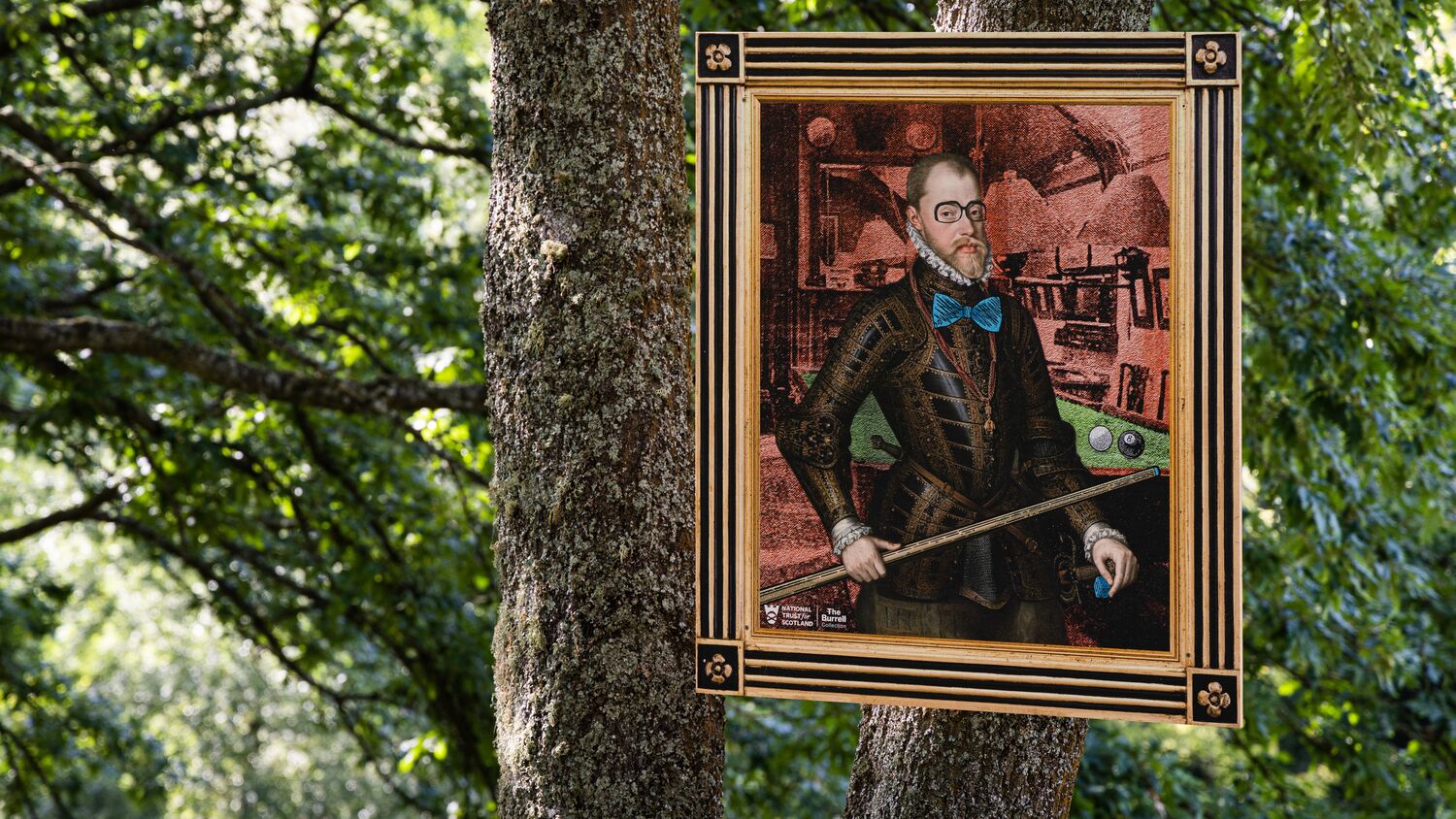 A portrait of a man in armour has been added to with new features drawn in including black glasses, a bright blue bow tie and he is holding a snooker cue. The portrait has been hung in a tree.